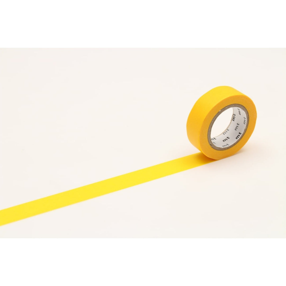 MT Basic washi tape in Yellow, 15mm x 7m roll with tape partly unrolled on a cream background