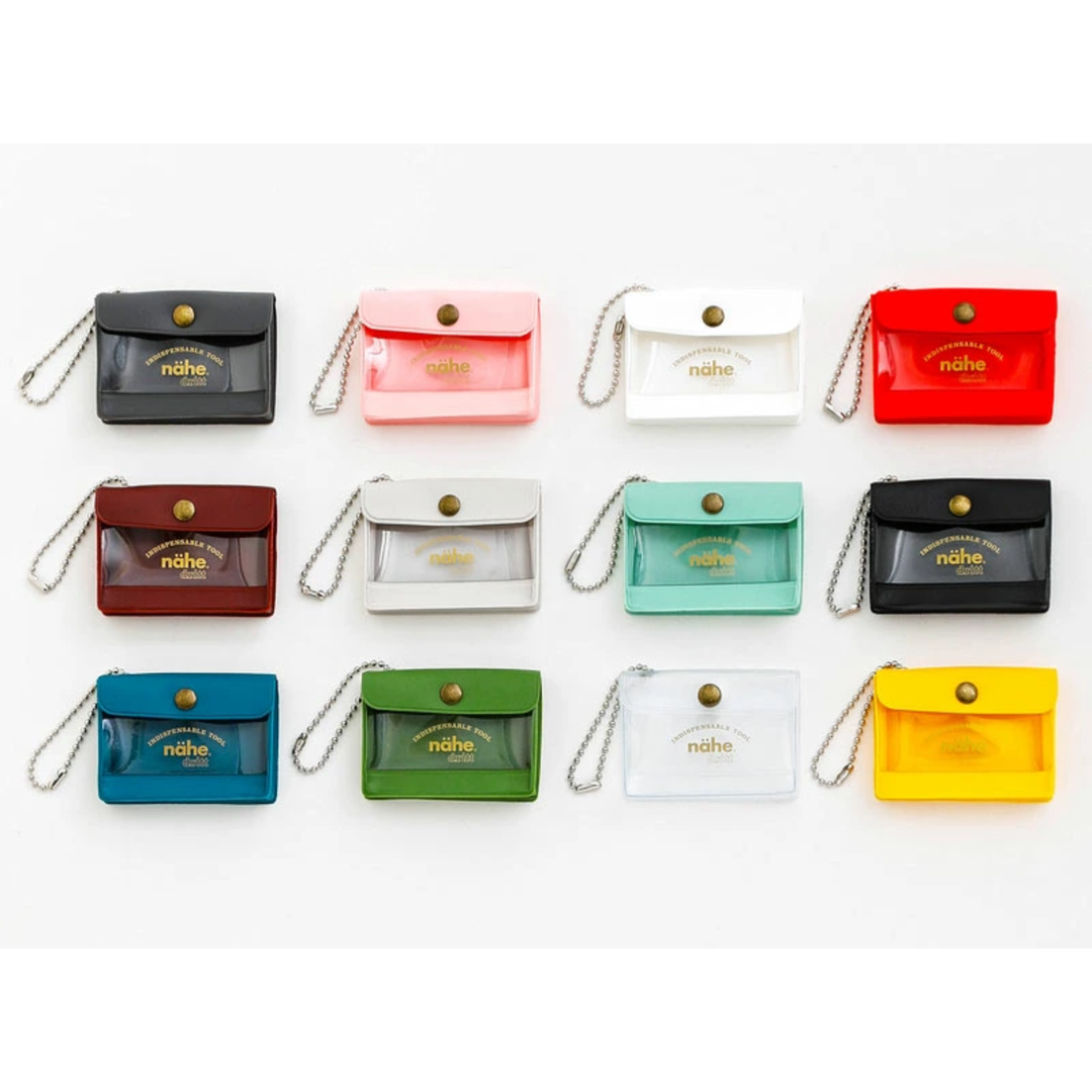 nähe General Purpose Case Mini in blue, palm-sized storage case with clear window, back pocket, and ball chain for carrying small items.