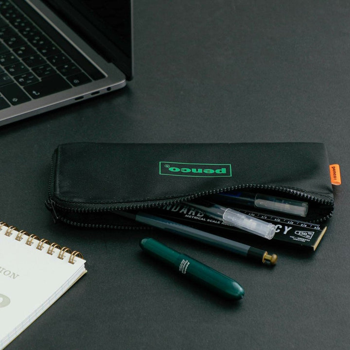 Penco Flat Pencil Case - Black - on desk with pens