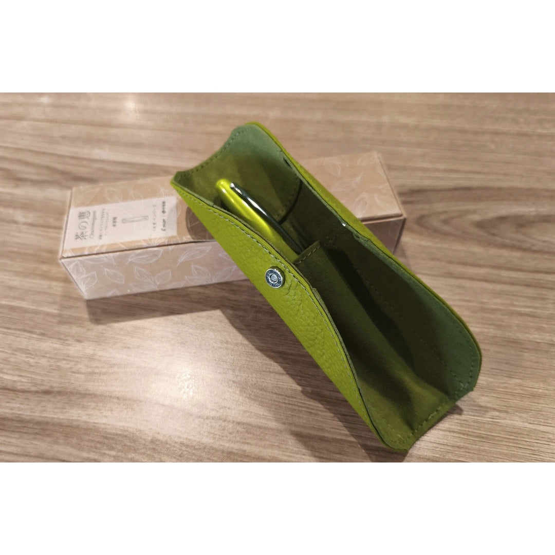 Pilot Chanomegumi tea leather pen sheath in light green, opened with a pen inside