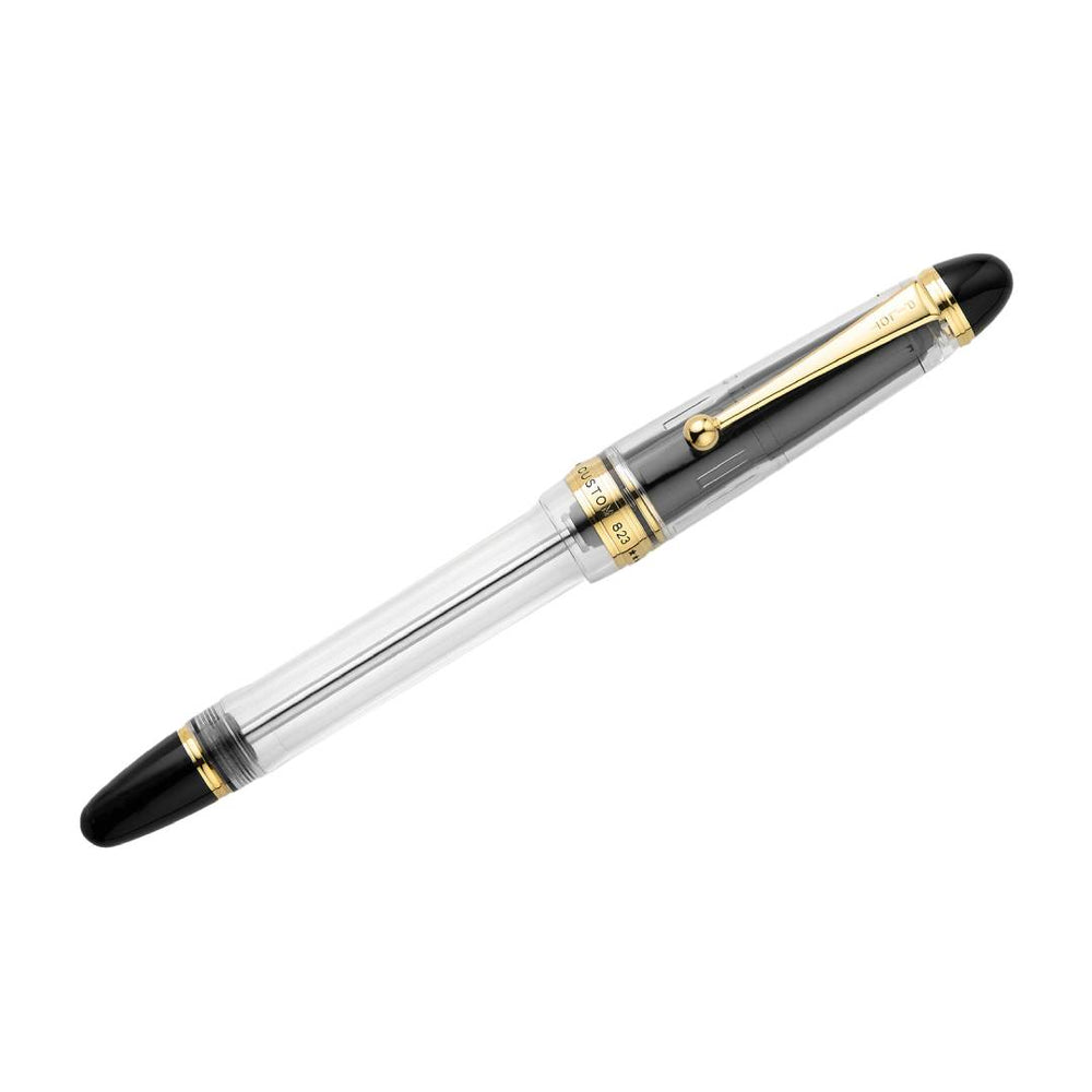 Pilot Custom 823 Fountain Pen in fully transparent clear resin with gold trim and 14K gold nib, featuring a high-capacity vacuum-filling system – perfect for showcasing ink flow and craftsmanship.