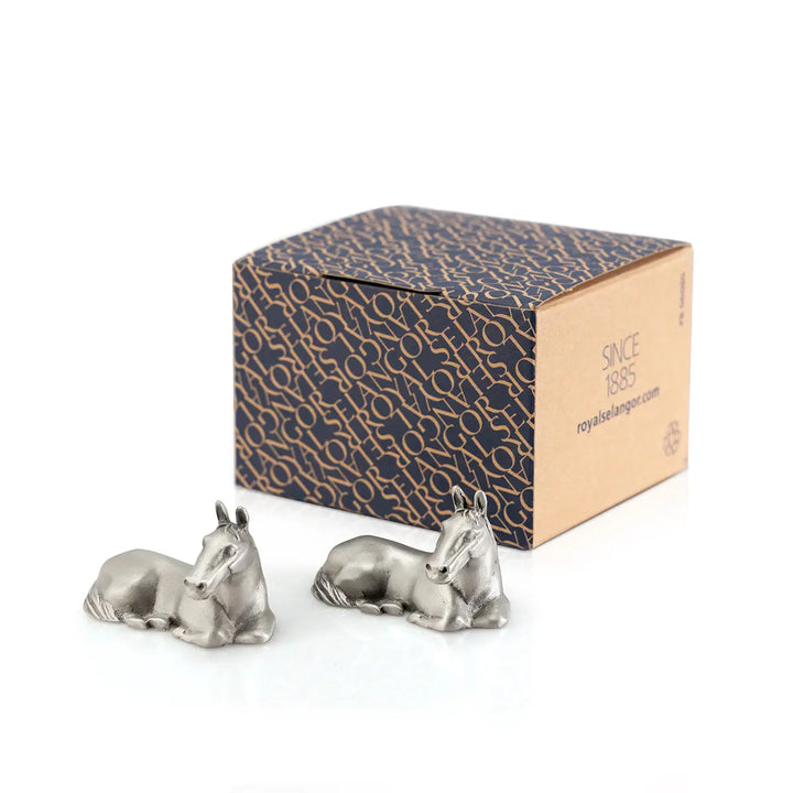 Pair of pewter horse-shaped chopstick rests, each sculpted in a calm reclining pose, symbolizing strength in stillness and adding an elegant zodiac touch to any dining table.