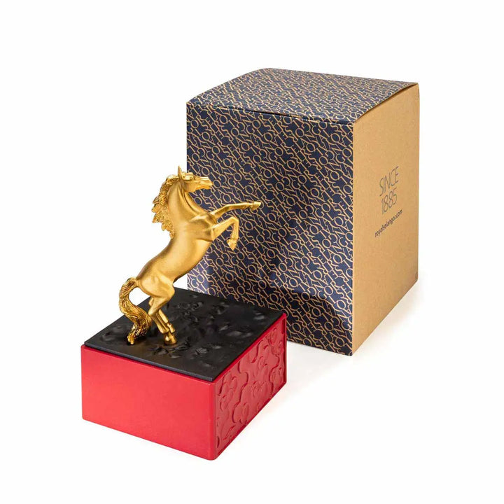 Royal Selangor 2026 Year of the Horse Figurine featuring a rearing 24K gilt horse mounted on a crimson resin base decorated with stylized waves, clouds, and rocks, symbolizing harmony and vitality.
