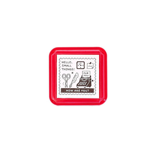 Load image into Gallery viewer, Eric Small Things Pre-Inked Stamp - Postage Stamp featuring a small square postal-themed design by Sanby Japan, displayed with its compact PET casing.
