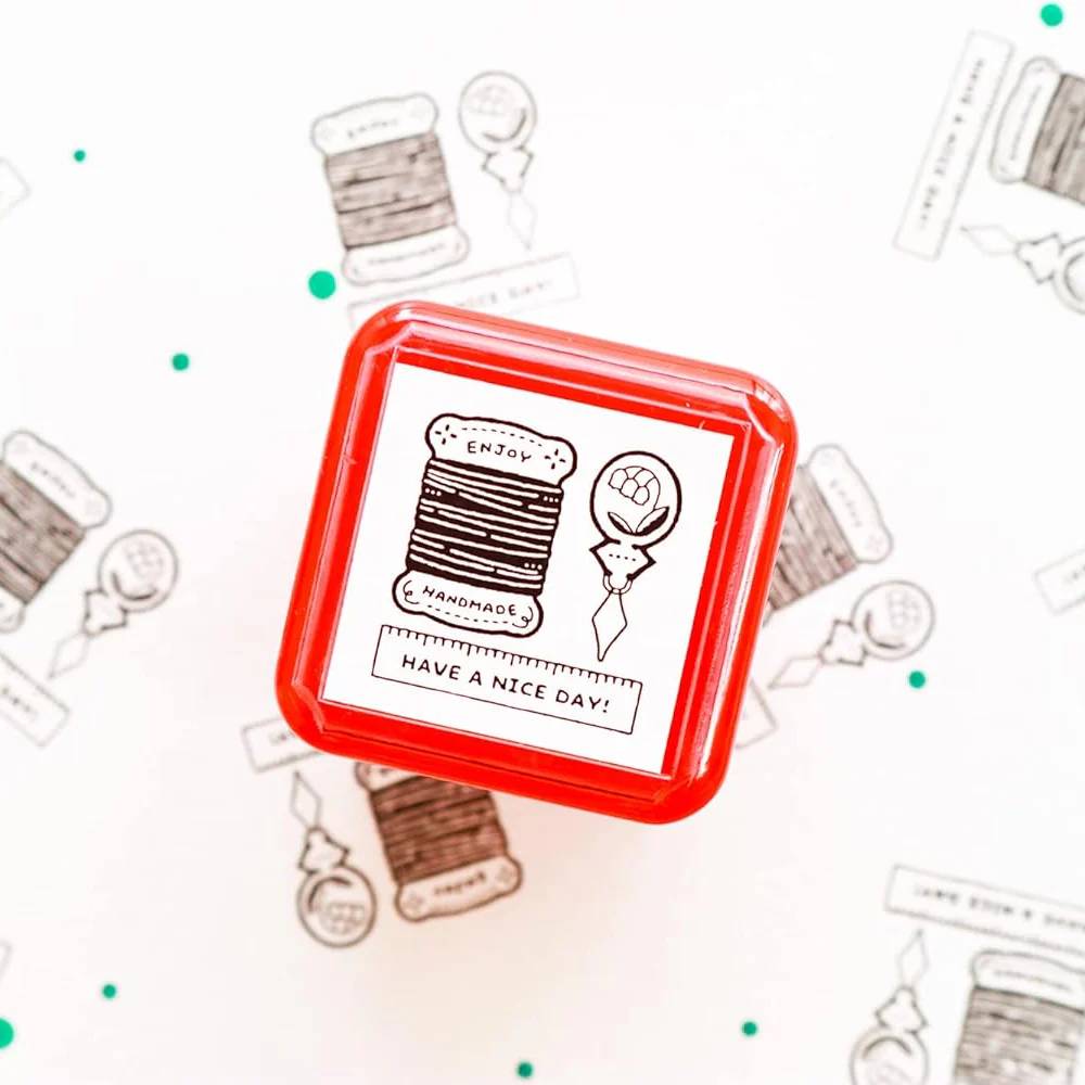 Eric Small Things Pre-Inked Stamp – Sewing Kit by Sanby Japan, compact black-ink stamp for journaling and planner decoration.
