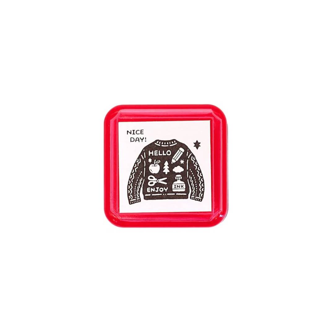 Sanby x Eric Small Things Pre-Inked Stamp – Sweater, compact Japanese pre-inked stamp with black ink for creative journaling and stationery use.