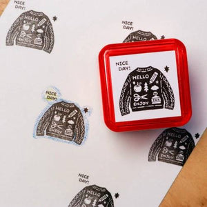 Sanby x Eric Small Things Pre-Inked Stamp – Sweater, compact Japanese pre-inked stamp with black ink for creative journaling and stationery use.