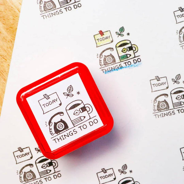 Load image into Gallery viewer, Sanby x Eric Small Things Pre-Inked Stamp – Things To Do, compact Japanese planner stamp with black ink.
