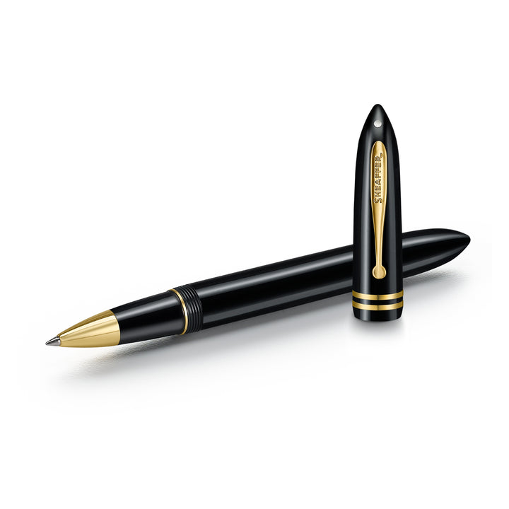 Sheaffer Balance III E893 rollerball pen uncapped beside its cap, showing the gold Sheaffer-engraved clip
