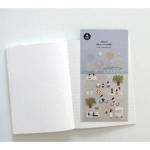 A sheet of decorative stickers featuring illustrations of fireworks, picnic blankets, pizza, drinks, people cycling, dogs, ice cream, and night sky scenes—perfect for journaling and capturing the atmosphere of a summer midnight picnic.