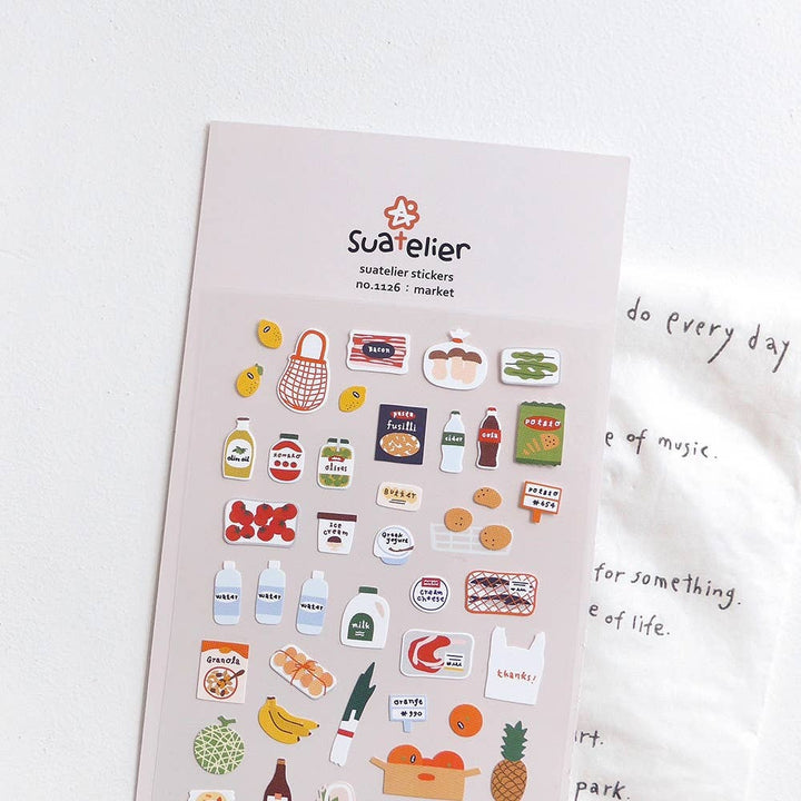 Suatelier Daily Deco Stickers Market sheet with grocery stickers, photographed at an angle