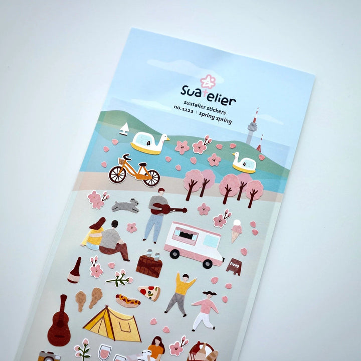 Suatelier Spring Spring sticker sheet shown at an angle with picnic and flower stickers
