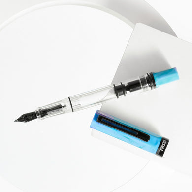 TWSBI ECO Fountain Pen Blue with Onyx cap and accents, transparent barrel, piston filler design.