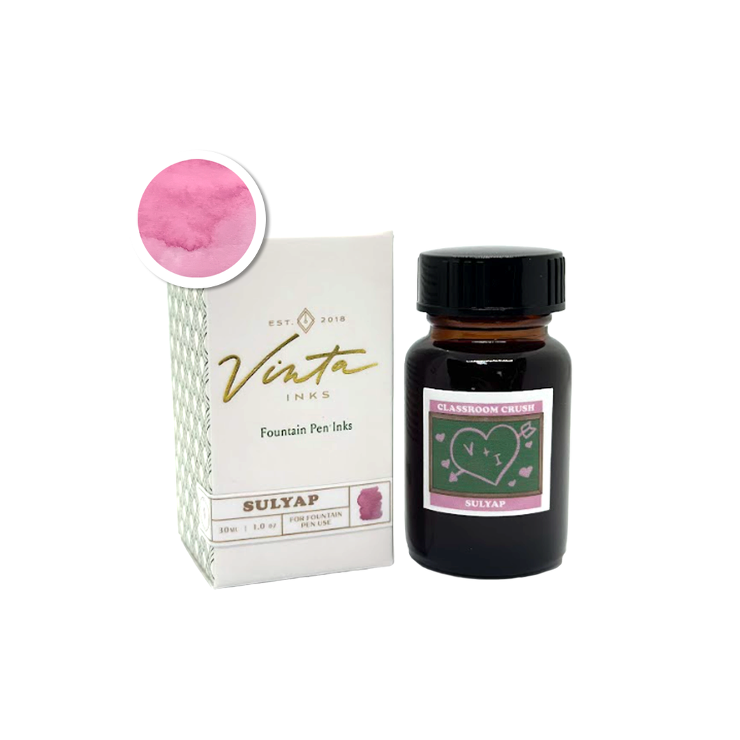 Amber glass bottle of Vinta Inks 30ml ink in the shade “Classroom Crush [Sulyap],” a flirty bubblegum pink hue. The bottle features a vintage-style label with handwritten elements, placed beside a swatch of the rosy pink ink.
