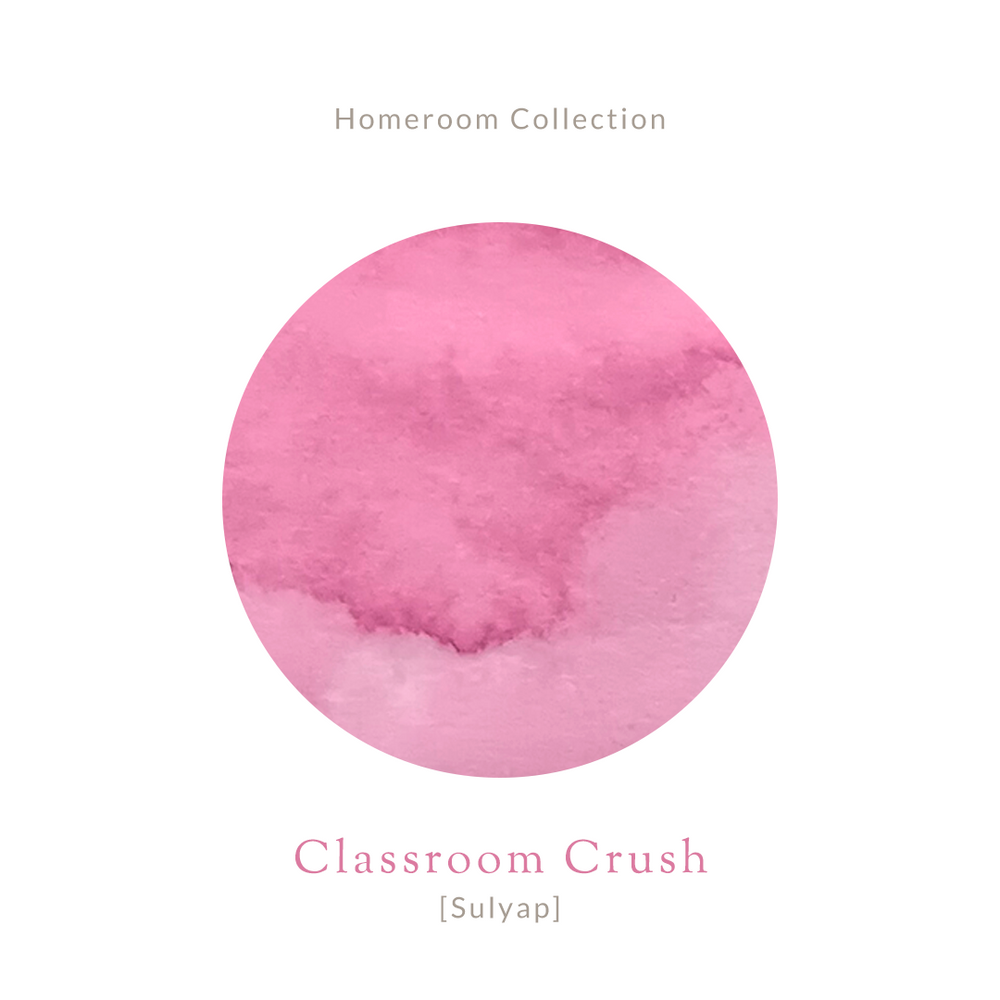 Amber glass bottle of Vinta Inks 30ml ink in the shade “Classroom Crush [Sulyap],” a flirty bubblegum pink hue. The bottle features a vintage-style label with handwritten elements, placed beside a swatch of the rosy pink ink.