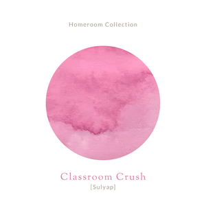 Amber glass bottle of Vinta Inks 30ml ink in the shade “Classroom Crush [Sulyap],” a flirty bubblegum pink hue. The bottle features a vintage-style label with handwritten elements, placed beside a swatch of the rosy pink ink.