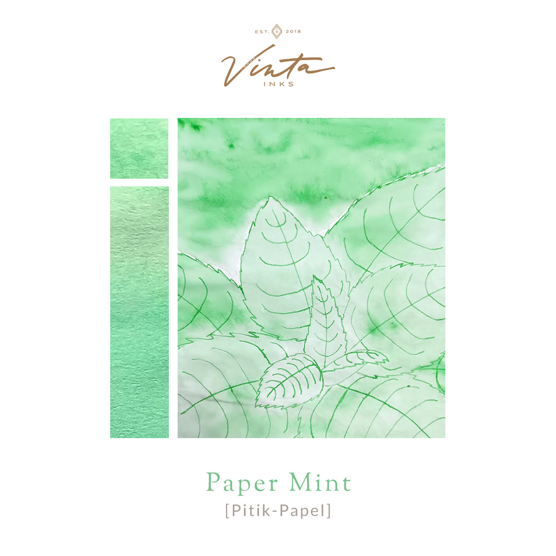 Amber glass bottle of Vinta Inks 30ml in the shade “Paper Mint [Pitik-Papel],” a light mint green ink. The bottle features a charming, nostalgic label and sits next to a swatch of the fresh, playful green ink on white paper.