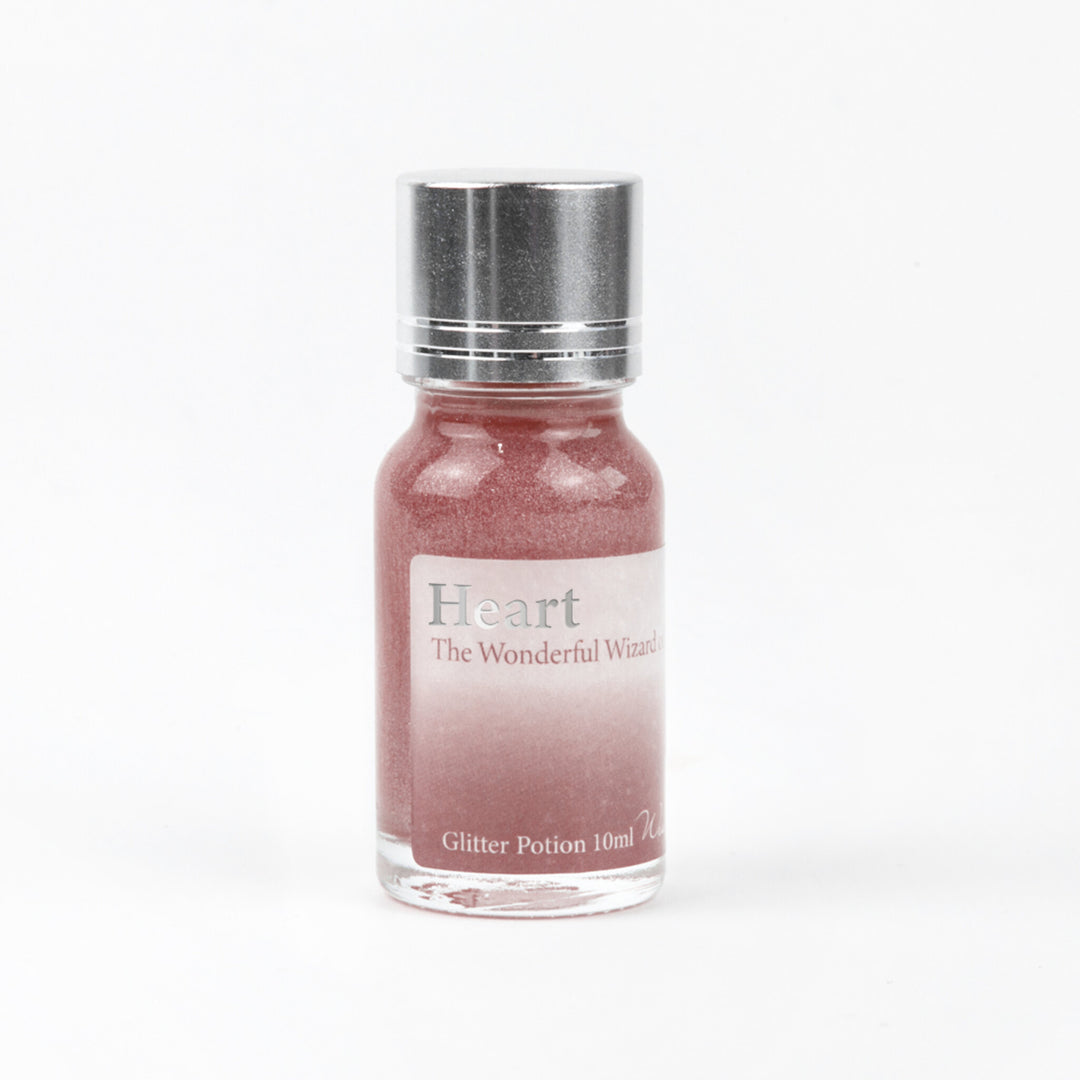 Wearingeul Heart (Wizard of Oz) Glitter Potion 10ml bottle with rose gold and silver glitter on a white background