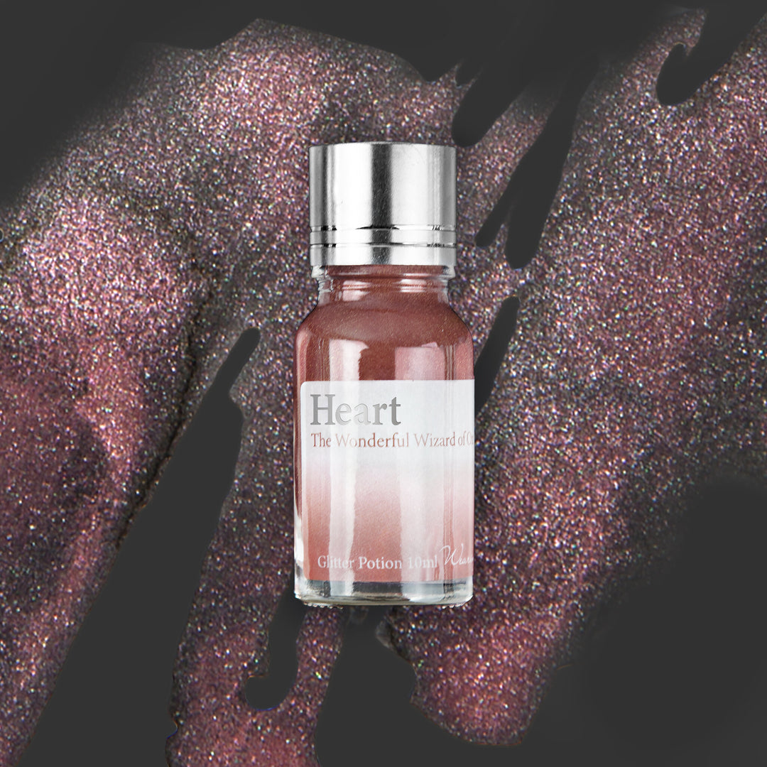 Wearingeul Heart (Wizard of Oz) Glitter Potion 10ml bottle on a coloured background