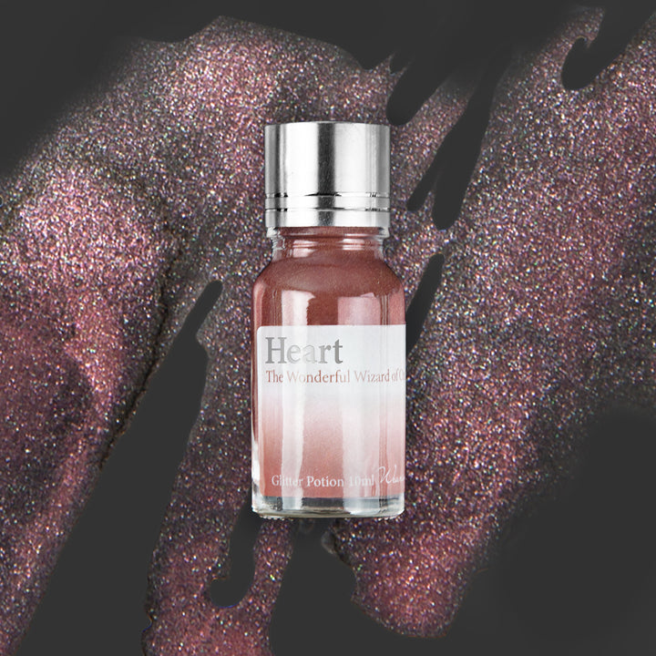 Wearingeul Heart (Wizard of Oz) Glitter Potion 10ml bottle on a coloured background