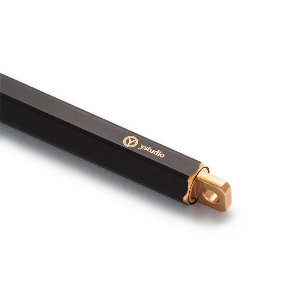 Ystudio Brassing Portable Ballpoint Pen Black — writing at an angle
