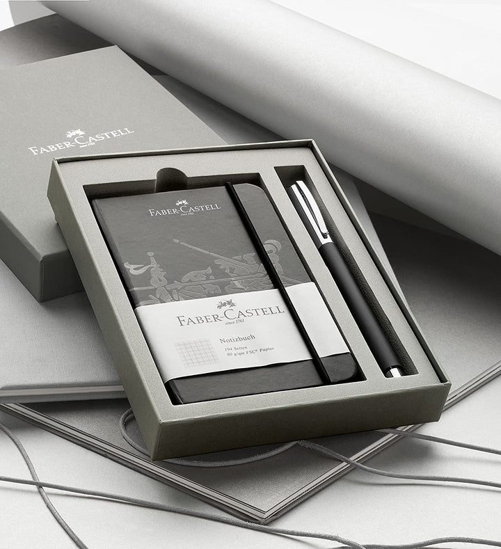 Faber-Castell Ambition Resin Ballpoint Pen Black Promo Set With Notebook — uncapped with cap posted