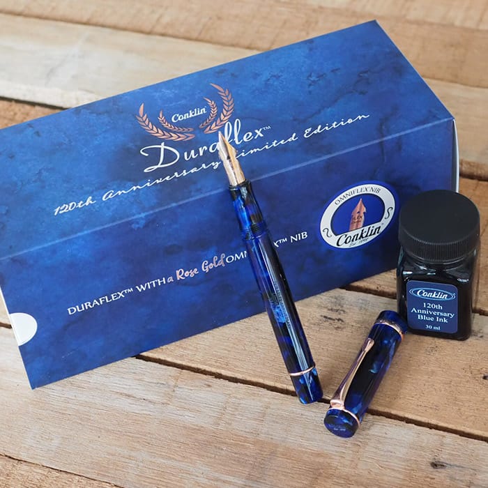 Conklin Duraflex 120th Anniversary Fountain Pen (Rose Gold Flex Nib) — flat lay