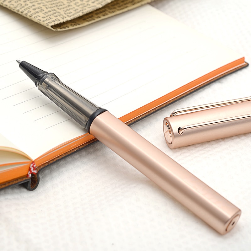 Lamy Lx Rollerball Pen Rose Gold — flat lay